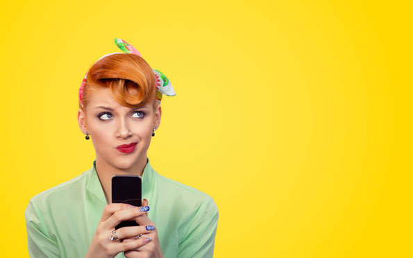 Social Media Manager in Surrey and London vintage hair curl woman on phone against yellow background
